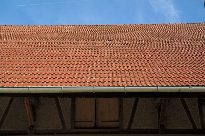 brown and white wooden house under blue sky during daytime